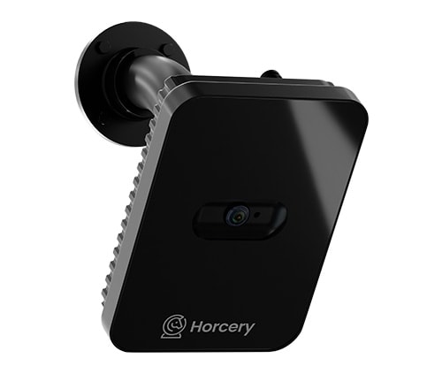 A mounted view of the Horcery Stall Monitor device, angled downward on a black wall bracket. The sleek black unit features the Horcery logo at the base.
