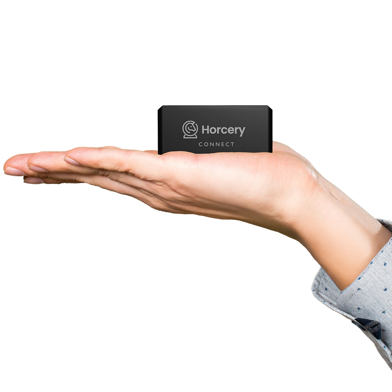 A person holds a compact Horcery Connect device in the palm of their hand, showcasing its small and portable size. The black device features the Horcery logo on its face, set against a clean white background.